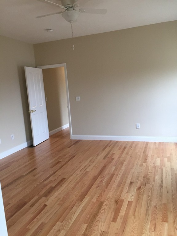 408 Nicholas Drive Lancaster, MA 01523 - Photo 18 of 30 wooden floor in an empty room