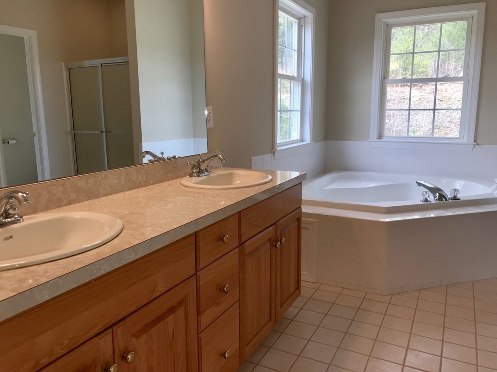 408 Nicholas Drive Lancaster, MA 01523 - Photo 19 of 30 a bathroom with a sink a vanity and a mirror