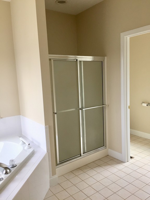 408 Nicholas Drive Lancaster, MA 01523 - Photo 23 of 30 a view of bathroom with bathtub and window
