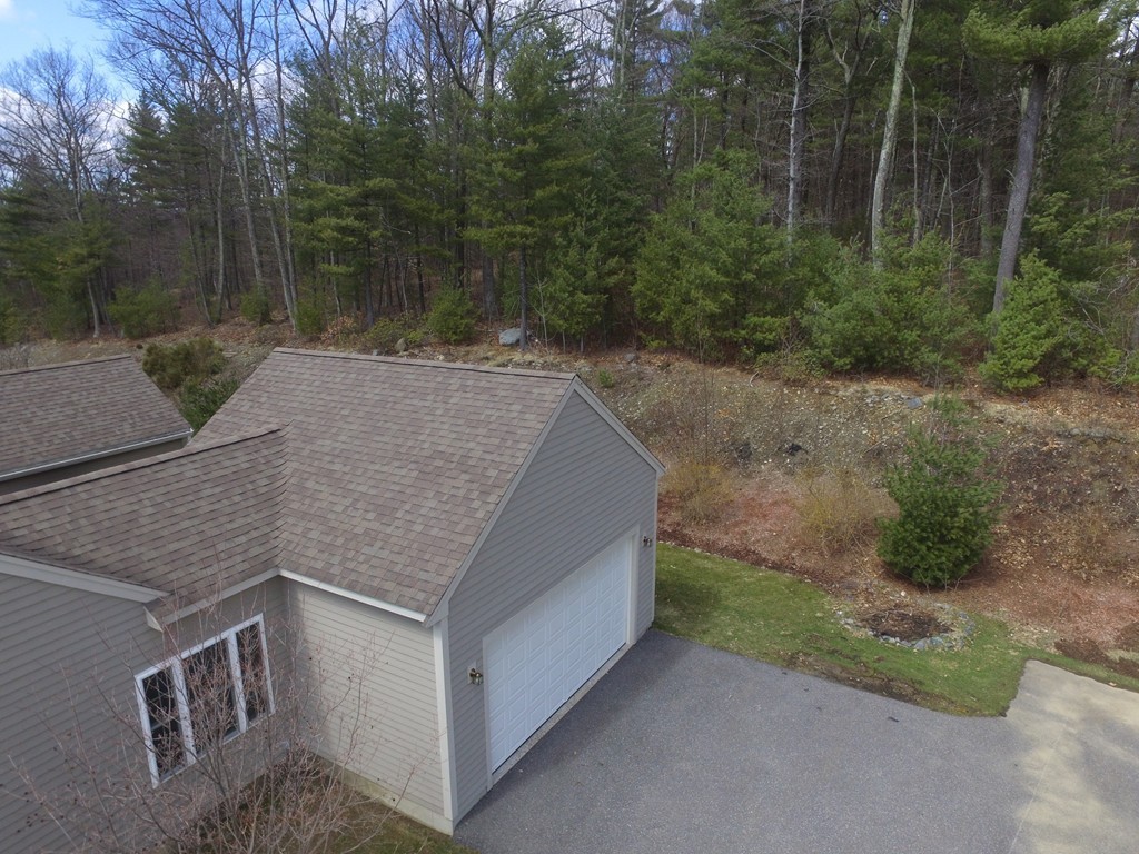 408 Nicholas Drive Lancaster, MA 01523 - Photo 28 of 30 a backyard of a house with lots of green space