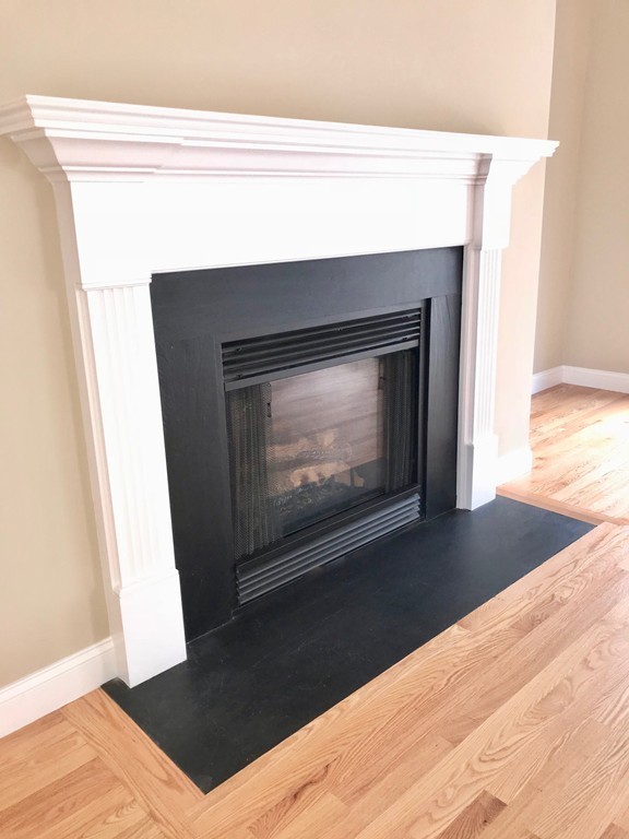 408 Nicholas Drive Lancaster, MA 01523 - Photo 7 of 30 a living room with a fireplace