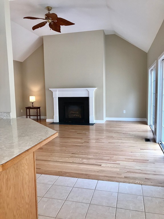 408 Nicholas Drive Lancaster, MA 01523 - Photo 8 of 30 a view of an empty room and fire place