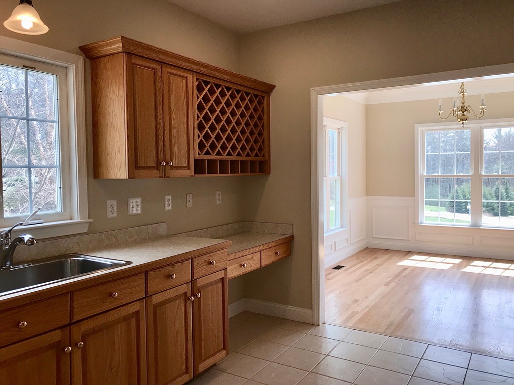 408 Nicholas Drive Lancaster, MA 01523 - Photo 10 of 30 a kitchen with a sink and a window