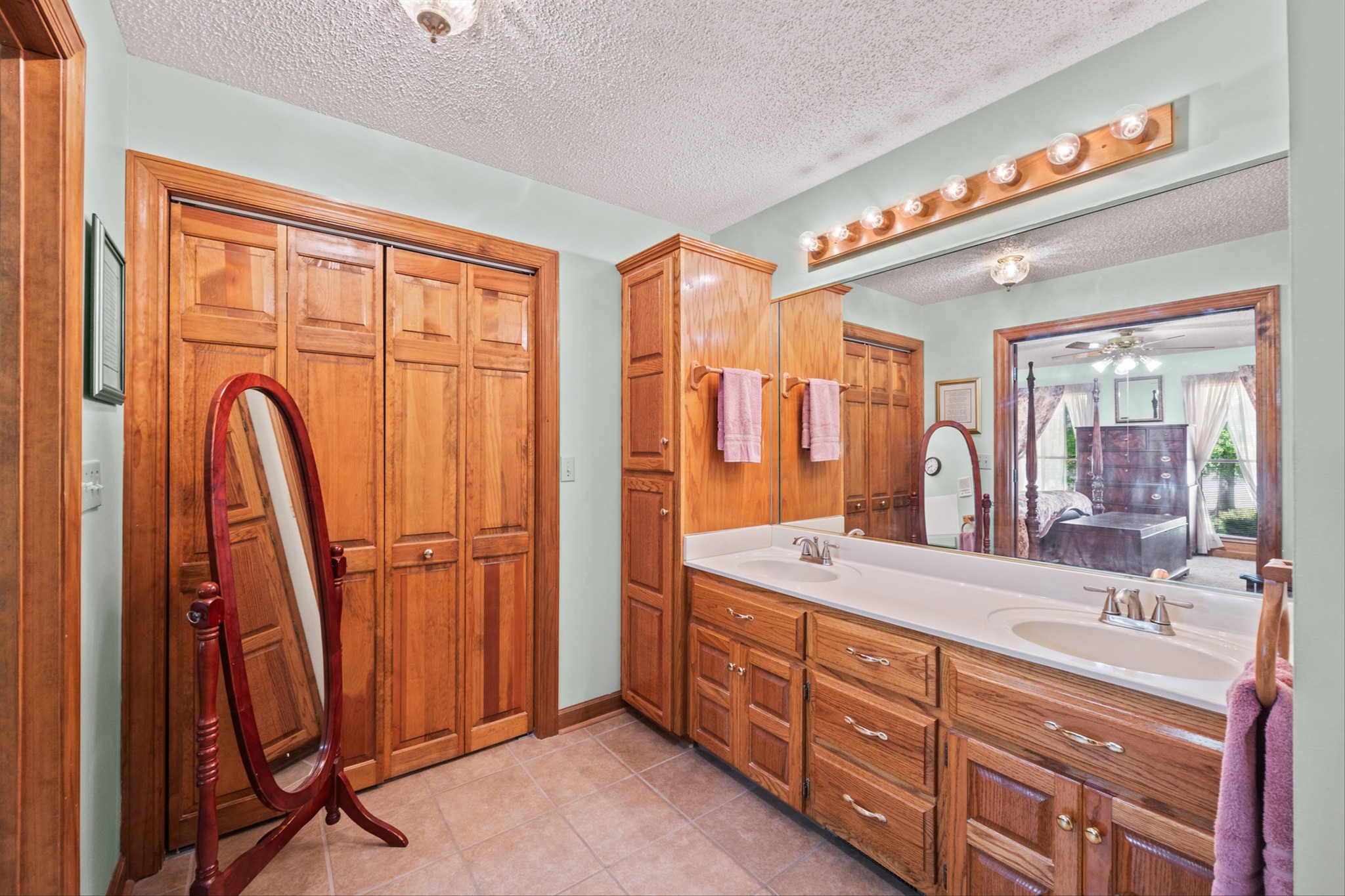28301 Lambert Road Ardmore, AL 35620 - Photo 15 of 47 a spacious bathroom with a double vanity sink a mirror and a shower