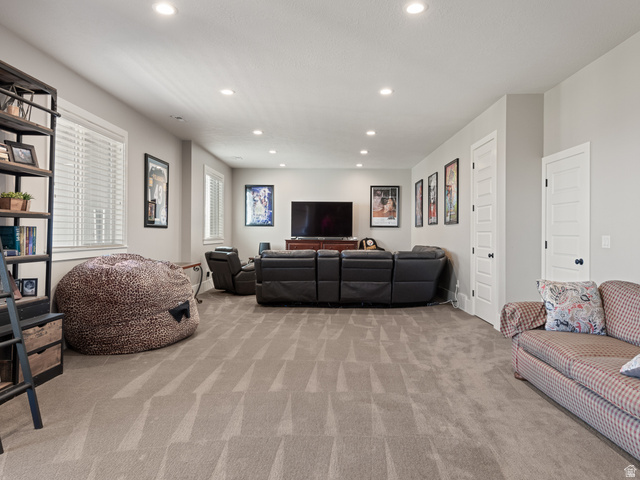 641 West 500 South Midway, UT 84049 - Photo 33 of 52 Spacious room featuring neutral carpeting, recessed lighting, and multiple windows with white blinds