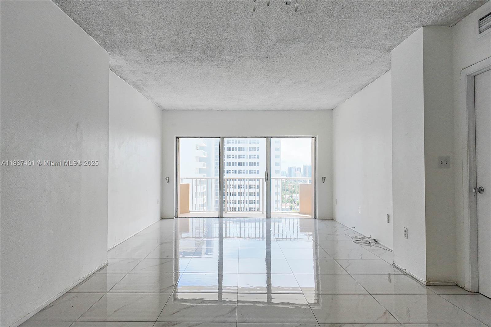 1980 South Ocean Drive, Unit 17L Hallandale Beach, FL 33009 - Photo 3 of 18 a view of an empty room with window