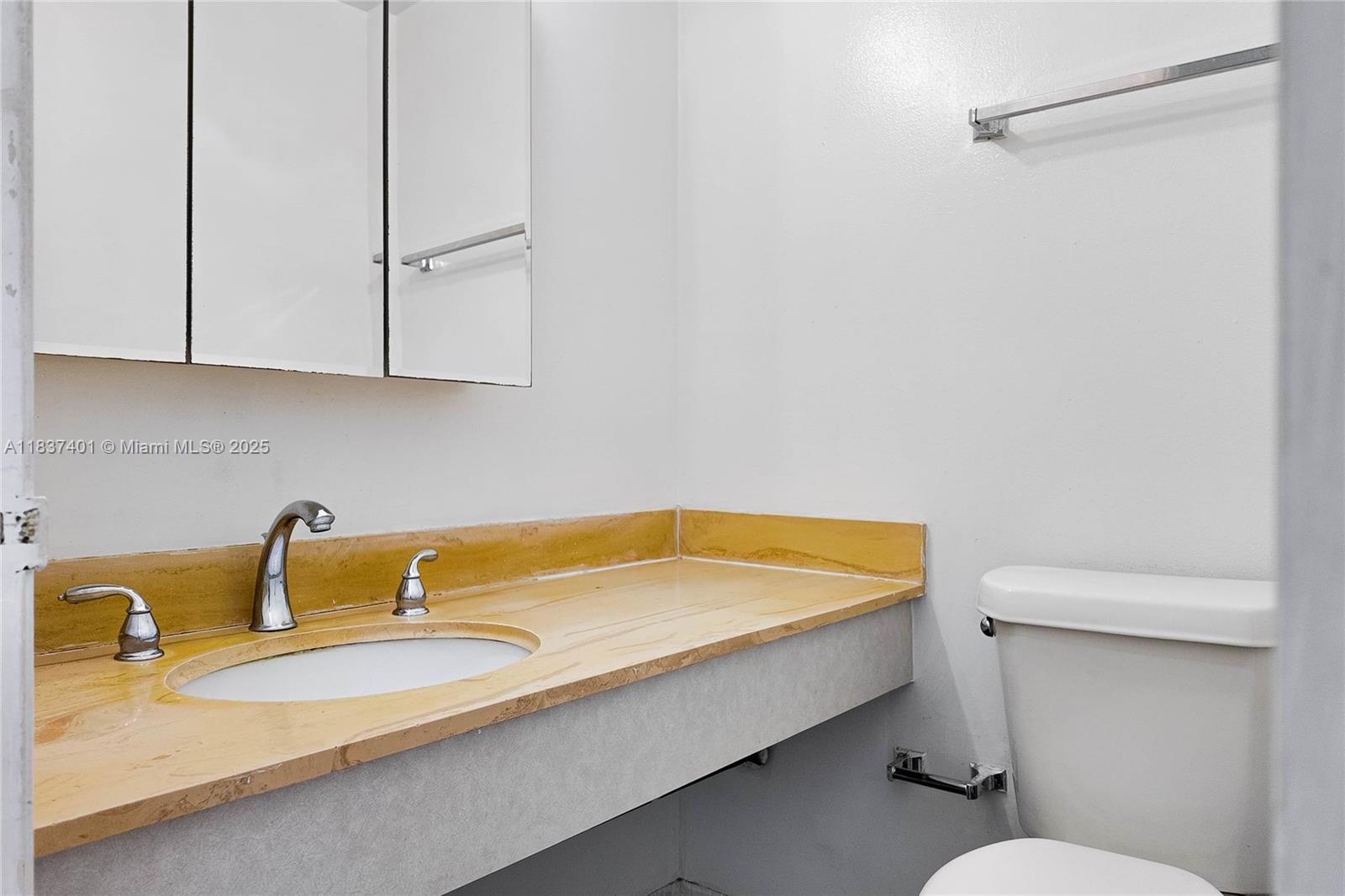 1980 South Ocean Drive, Unit 17L Hallandale Beach, FL 33009 - Photo 4 of 18 a bathroom with a sink and a toilet