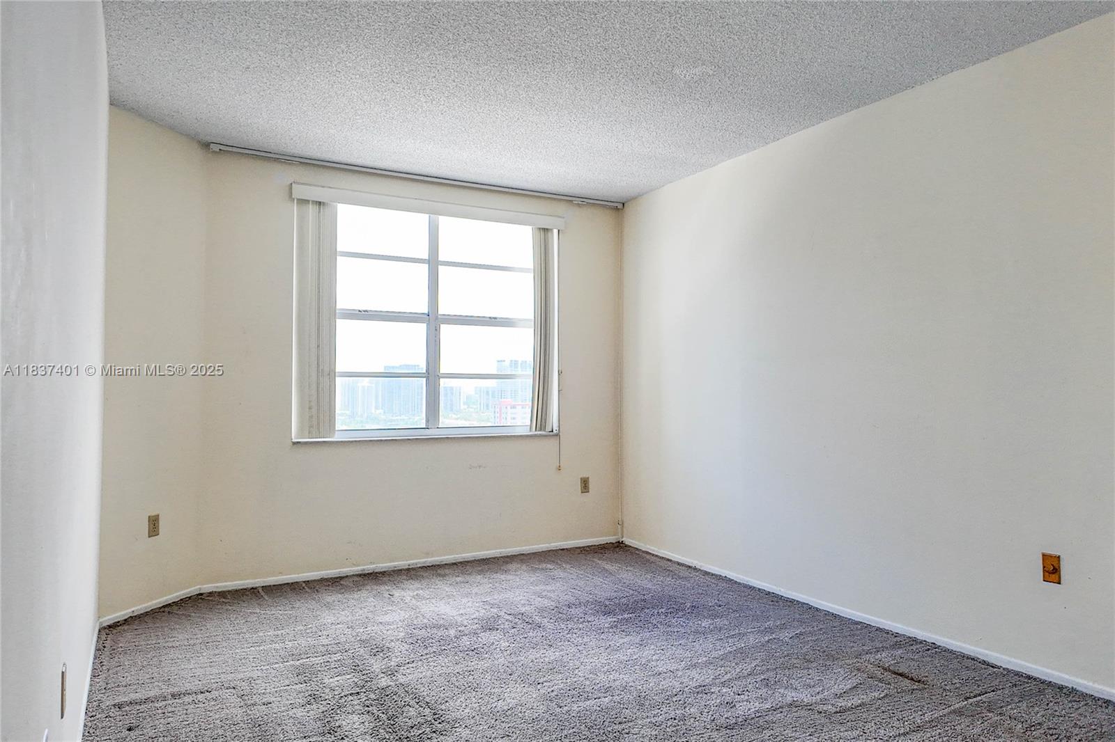 1980 South Ocean Drive, Unit 17L Hallandale Beach, FL 33009 - Photo 7 of 18 an empty room with a window