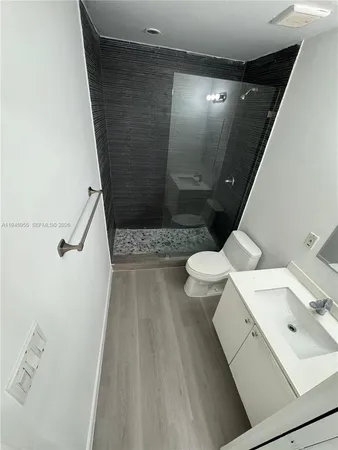 a bathroom with a sink and toilet
