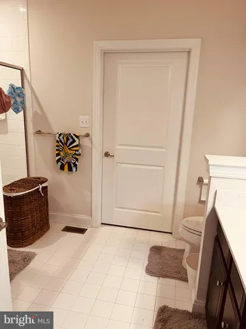 a view of an empty room and wooden floor