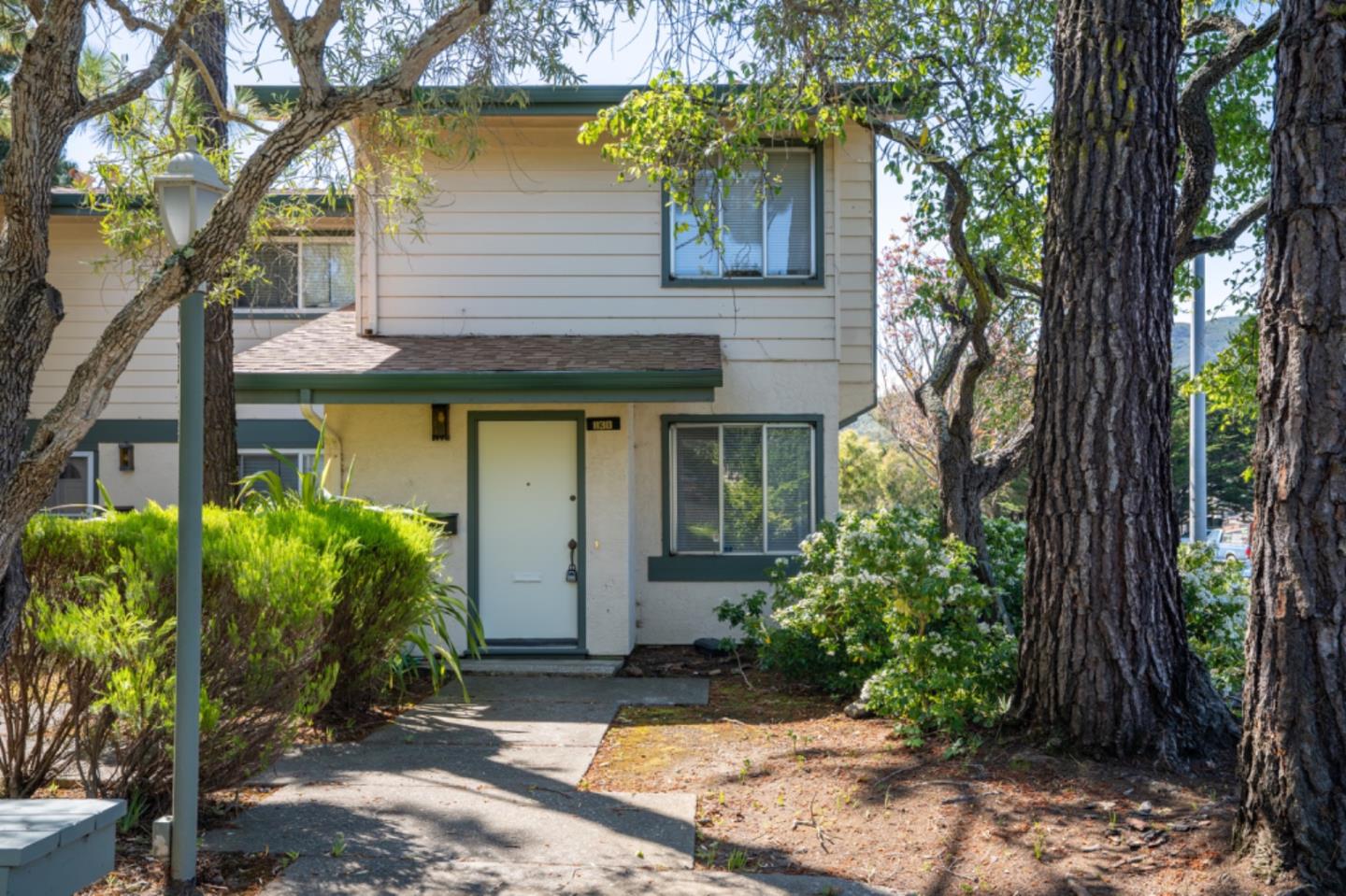 1130 Terra Nova Boulevard Pacifica, CA 94044 - Photo 1 of 15 a front view of a house with garden