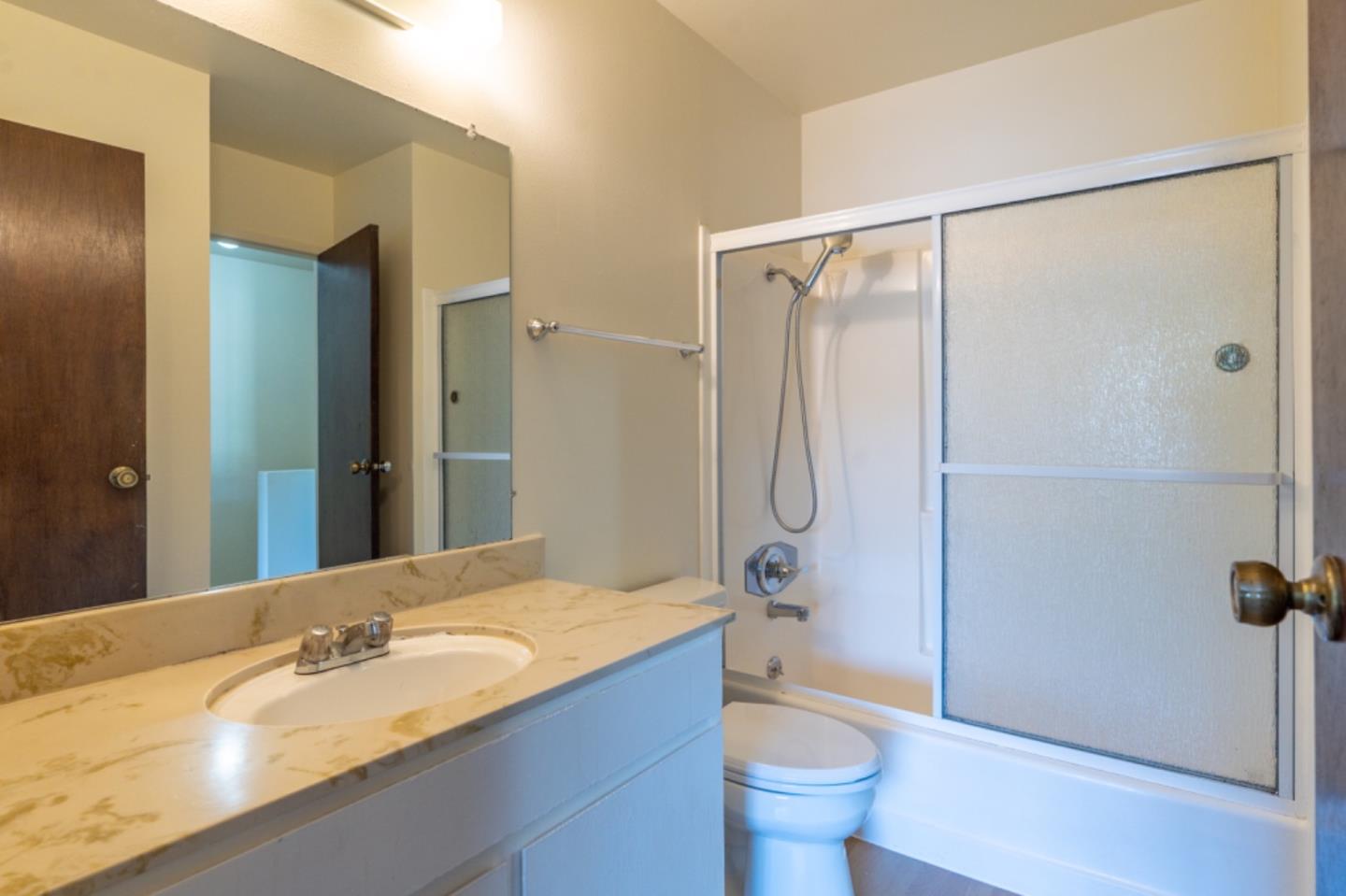 1130 Terra Nova Boulevard Pacifica, CA 94044 - Photo 15 of 15 a bathroom with a granite countertop sink toilet and shower