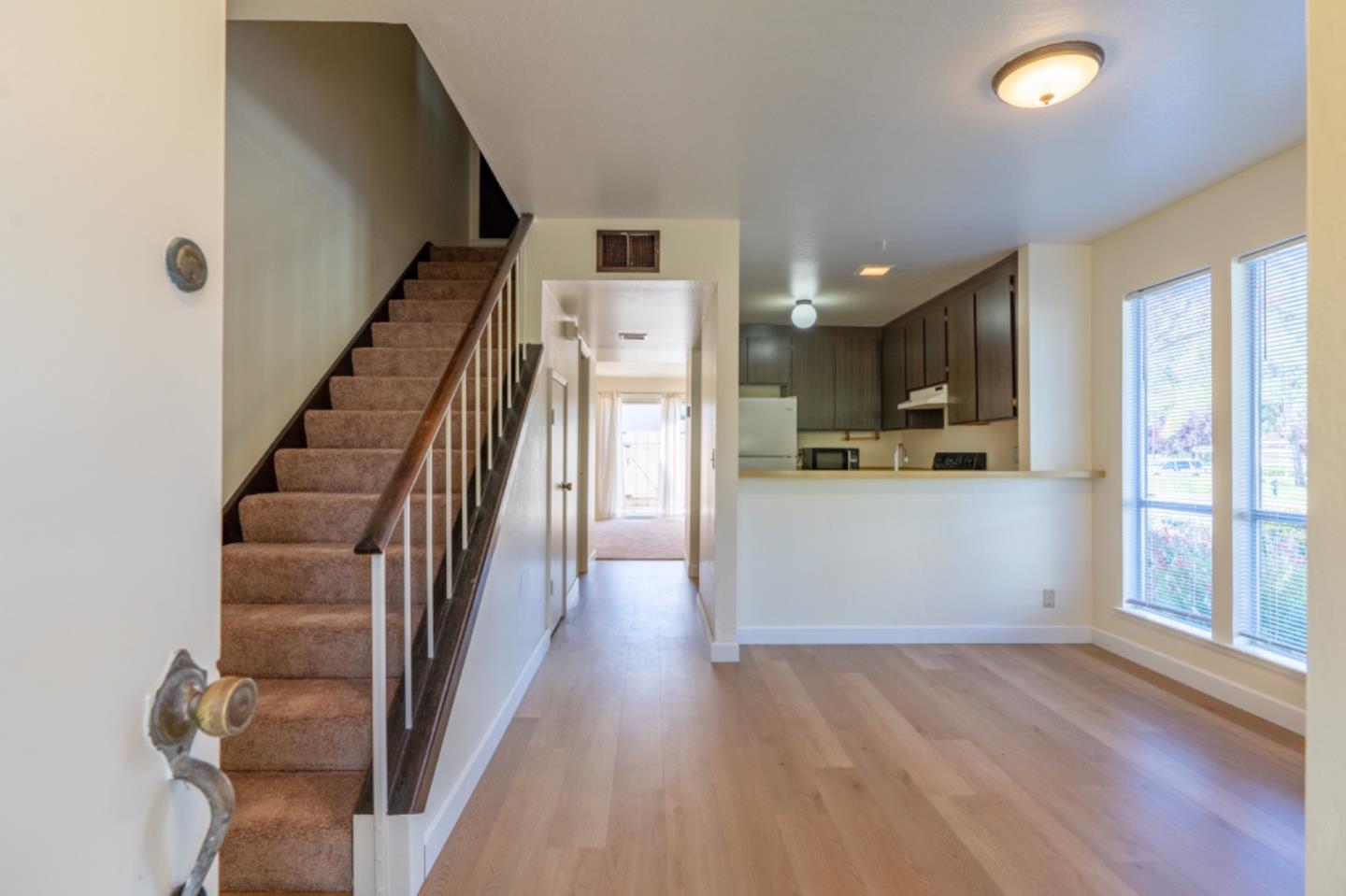 1130 Terra Nova Boulevard Pacifica, CA 94044 - Photo 2 of 15 a view of a kitchen with wooden floor and electronic appliances