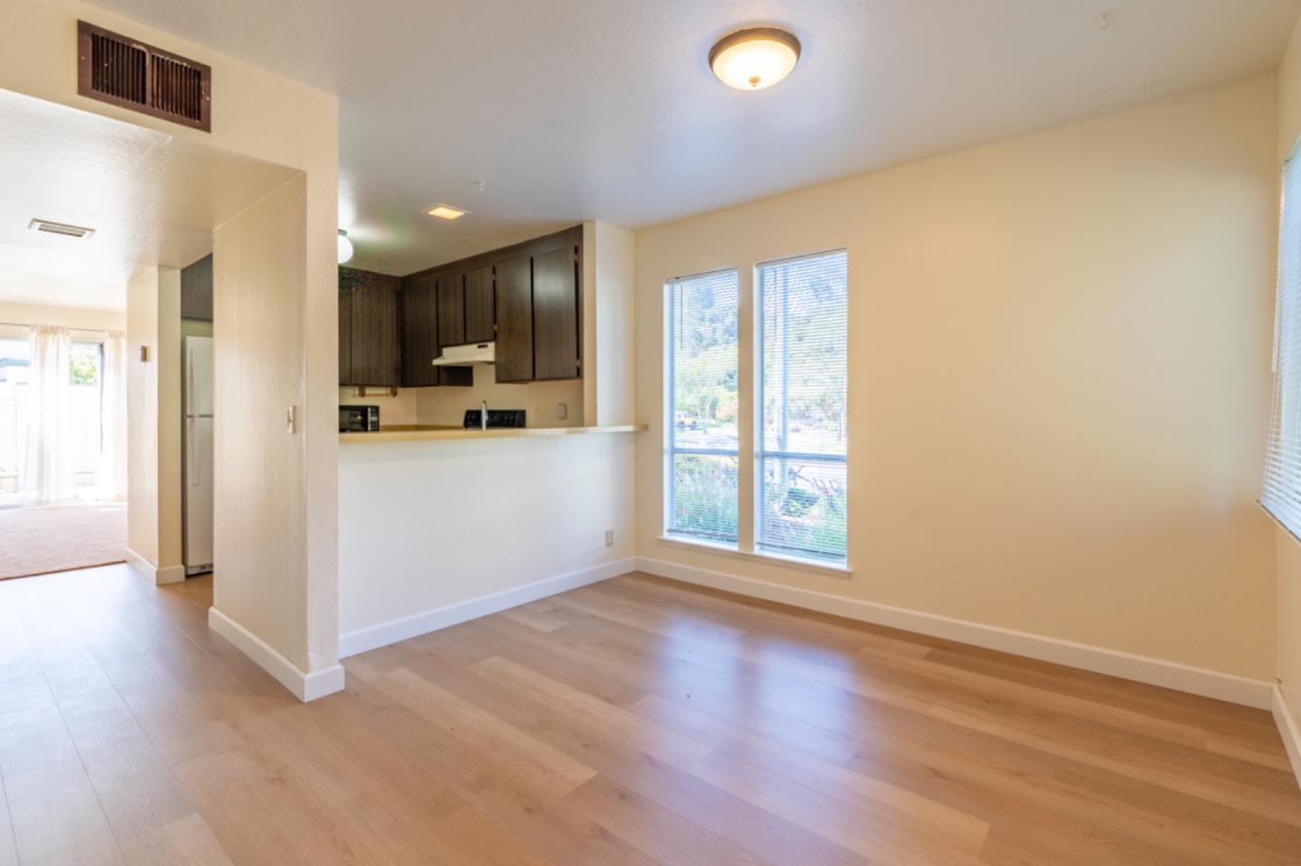 1130 Terra Nova Boulevard Pacifica, CA 94044 - Photo 3 of 15 a view of a kitchen with wooden floor and a window