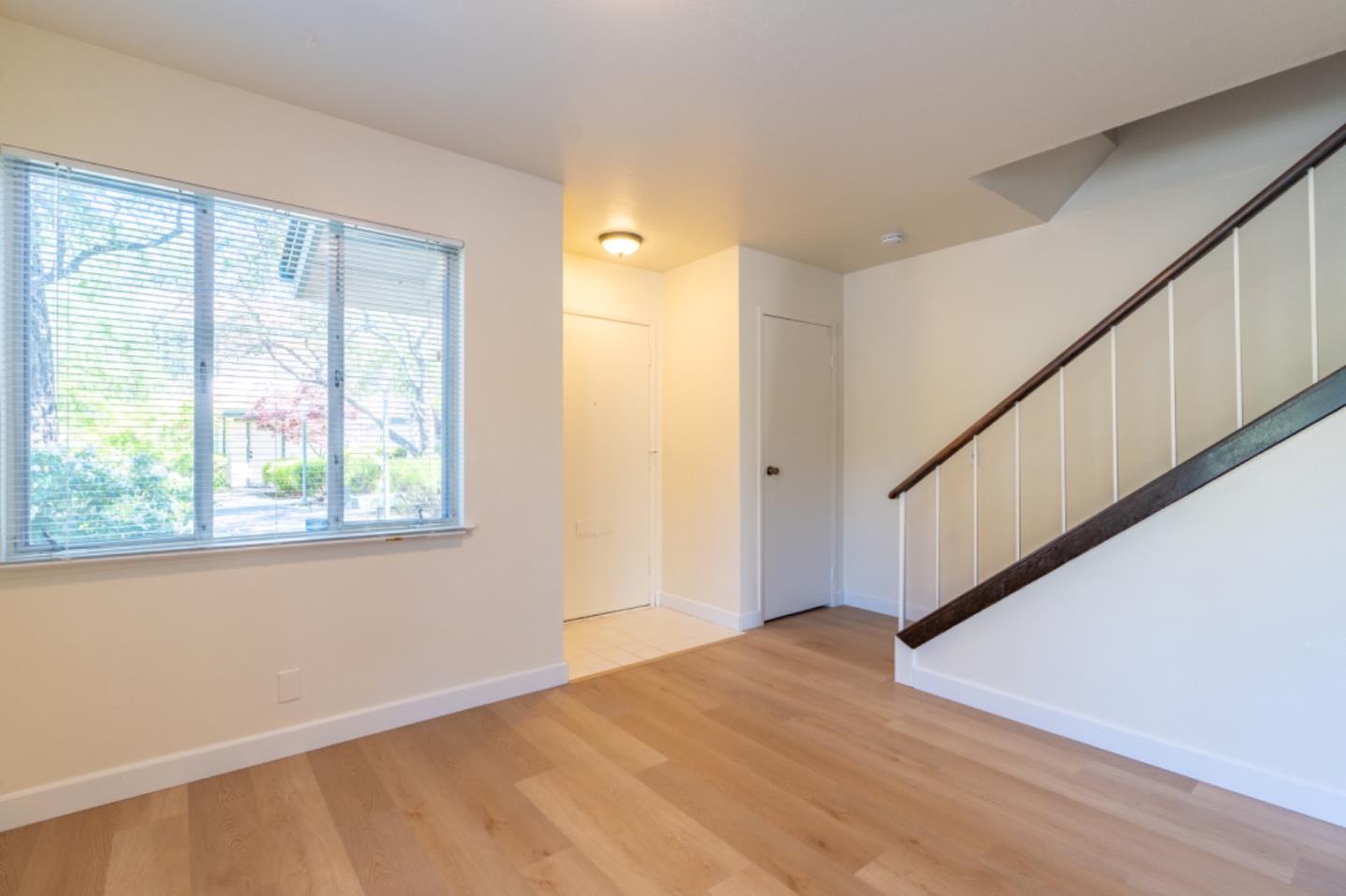 1130 Terra Nova Boulevard Pacifica, CA 94044 - Photo 5 of 15 a view of an empty room with wooden floor and a window