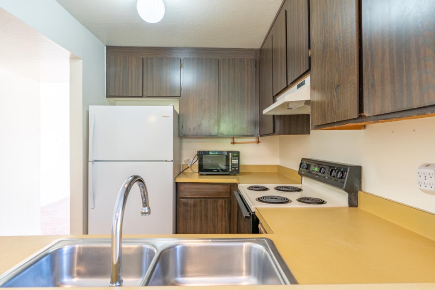 1130 Terra Nova Boulevard Pacifica, CA 94044 - Photo 6 of 15 a kitchen with a sink a stove and cabinets