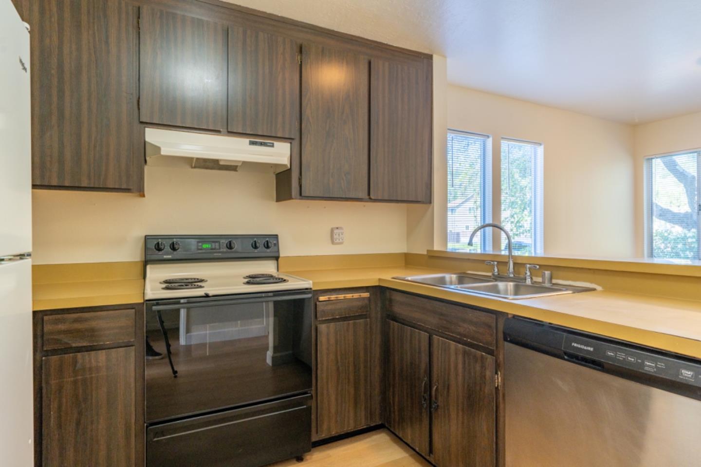 1130 Terra Nova Boulevard Pacifica, CA 94044 - Photo 7 of 15 a kitchen with a sink and a refrigerator