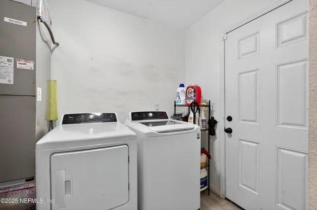 a utility room with dryer and washer