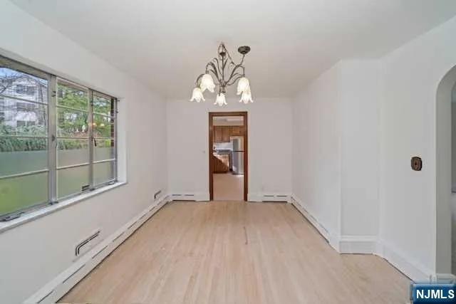 a view of an empty room with a window