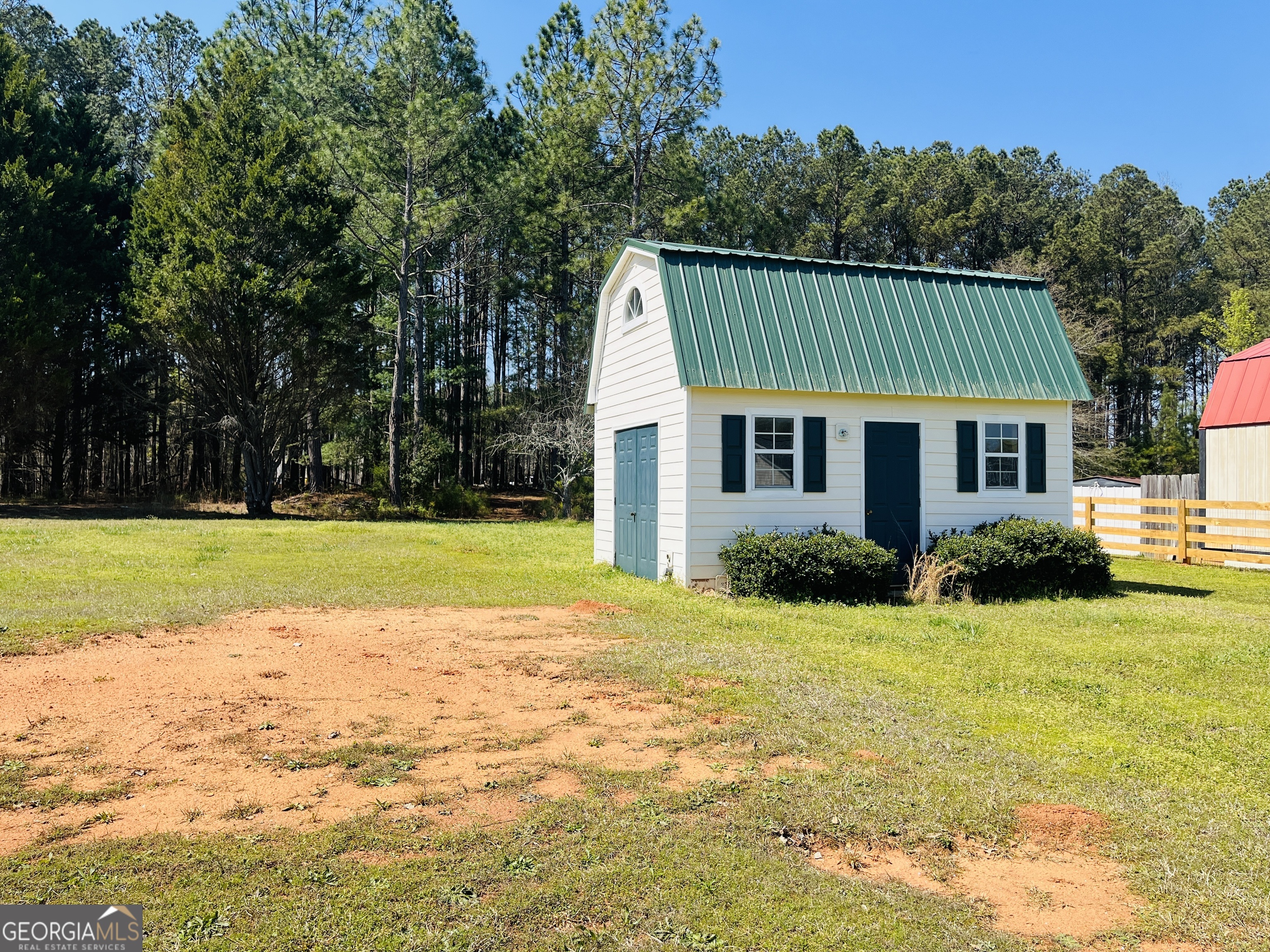 405 Peeks Crossing Drive Senoia, GA 30276 - Photo 30 of 31 a view of a house with a swimming pool