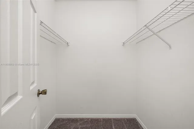 a view of small space with empty racks on the wall