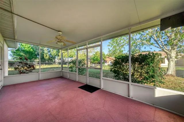 en empty room with large windows