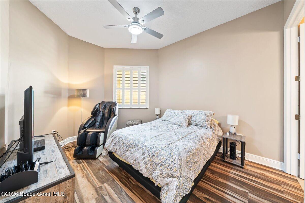 6005 Highway 1, Unit 101 Rockledge, FL 32955 - Photo 23 of 57 a bedroom with a bed and a flat screen tv
