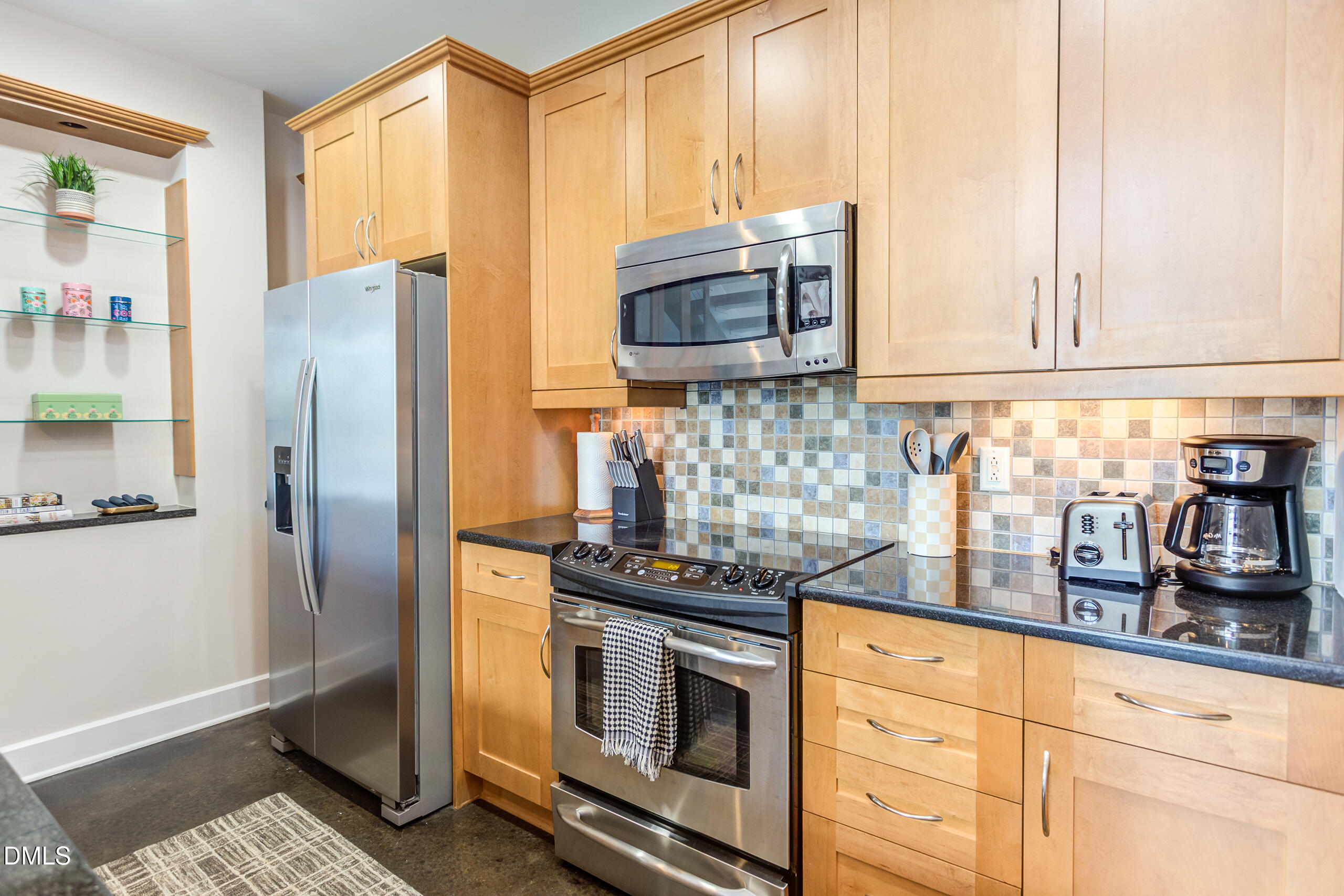 2608 Erwin Road, Unit 417 Durham, NC 27705 - Photo 8 of 50 a kitchen with stainless steel appliances granite countertop a refrigerator and a stove