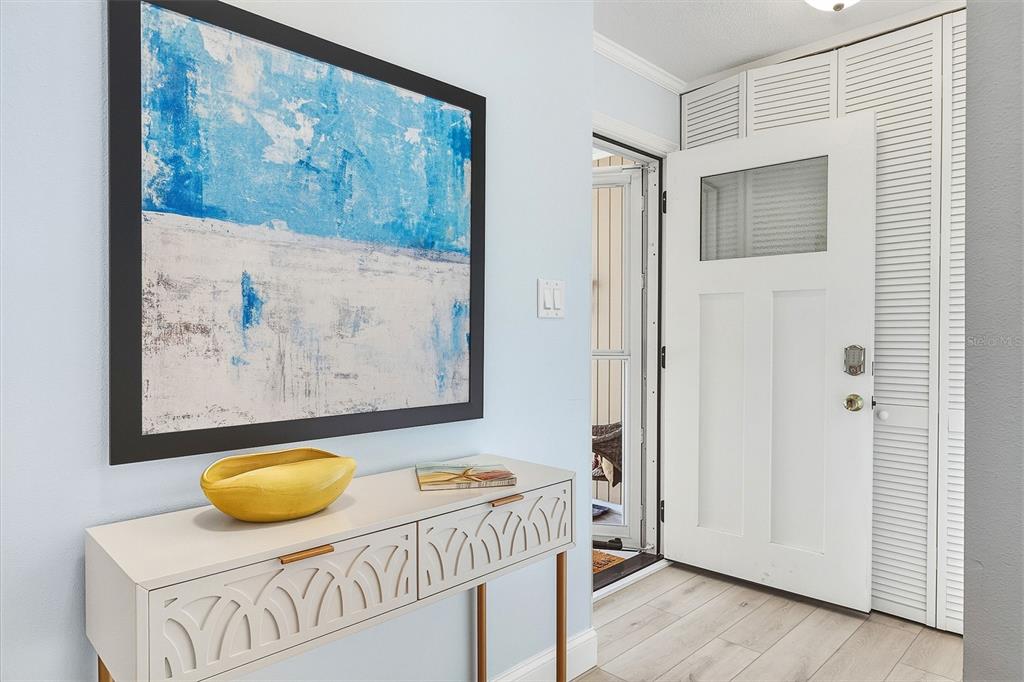 6300 Midnight Pass Road, Unit 21 Sarasota, FL 34242 - Photo 6 of 30 a bedroom with a bed and painting on the wall