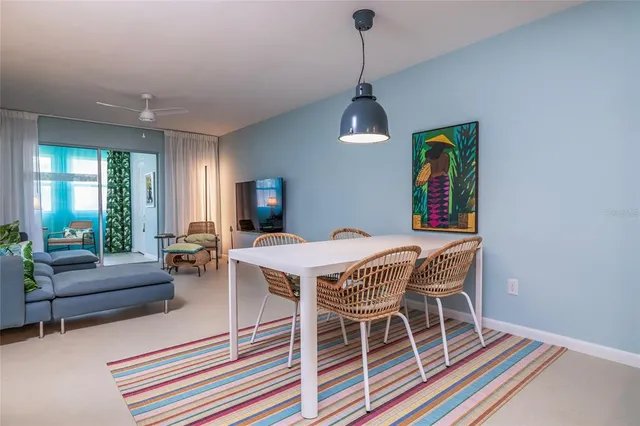 a kitchen with white cabinets and sink