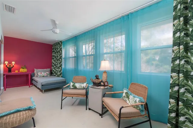 a bedroom with furniture and a baby crib