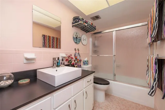 a bedroom with a bed and a table