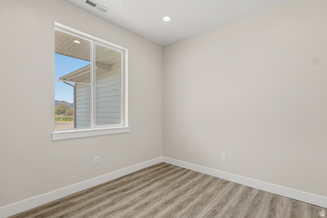 169 West 100 South Joseph, UT 84739 - Photo 8 of 35 Unfurnished room with light wood-type flooring and recessed lighting