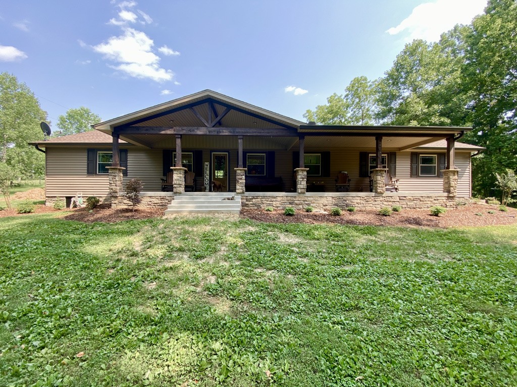560 Butler Bridge Road Portland, TN 37148 - Photo 1 of 26 a front view of house with yard outdoor seating and barbeque oven