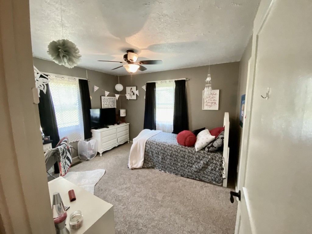 560 Butler Bridge Road Portland, TN 37148 - Photo 14 of 26 a living room with furniture and a flat screen tv