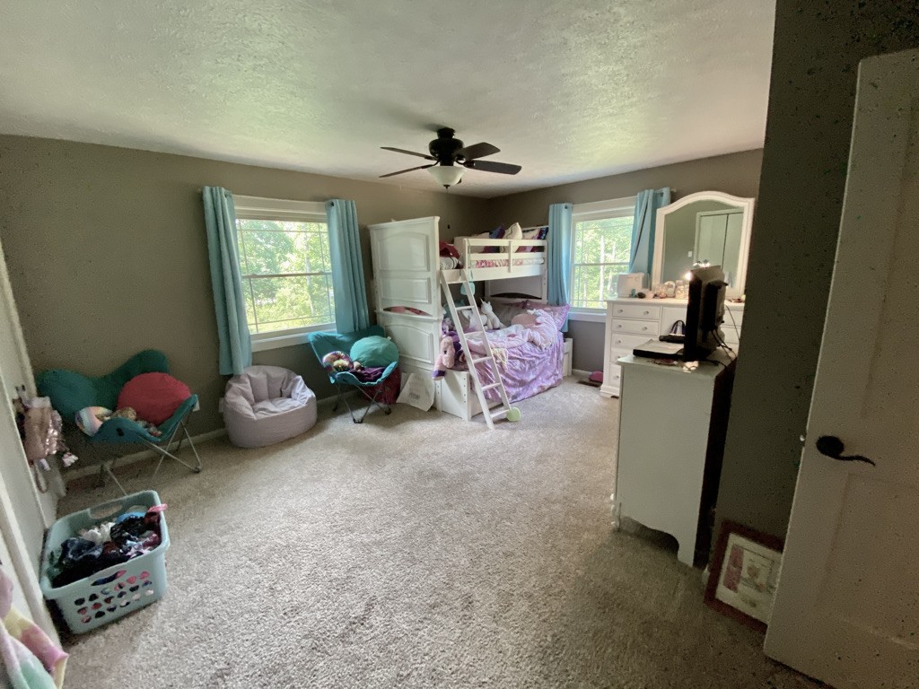 560 Butler Bridge Road Portland, TN 37148 - Photo 16 of 26 a living room with furniture a window and gym equipment