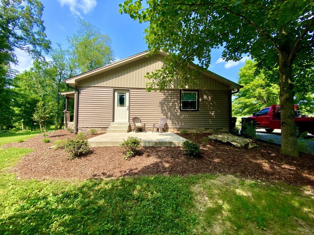 560 Butler Bridge Road Portland, TN 37148 - Photo 17 of 26 a backyard of a house with table and chairs