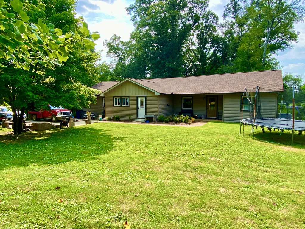 560 Butler Bridge Road Portland, TN 37148 - Photo 25 of 26 a front view of a house with a yard table and chairs
