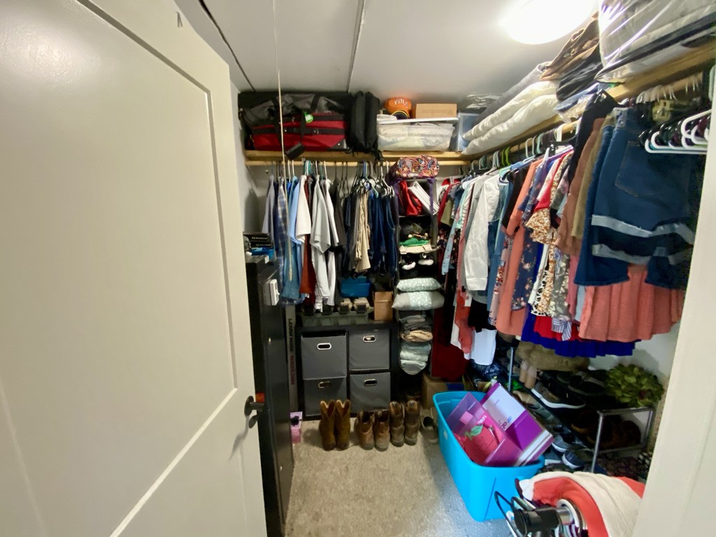 560 Butler Bridge Road Portland, TN 37148 - Photo 8 of 26 a view of walk in closet with clothes and shoes