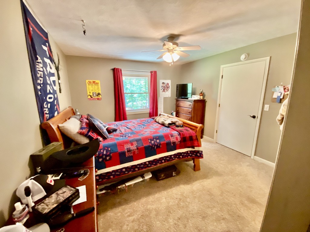 560 Butler Bridge Road Portland, TN 37148 - Photo 10 of 26 a bedroom with a bed and wooden floor