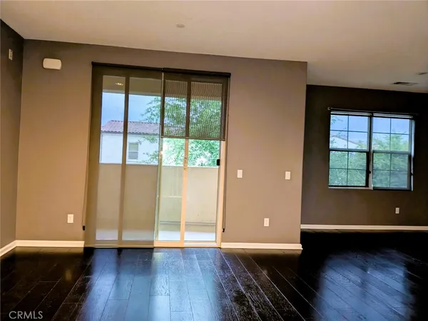 a view of kitchen with stainless steel appliances granite countertop a refrigerator and a stove