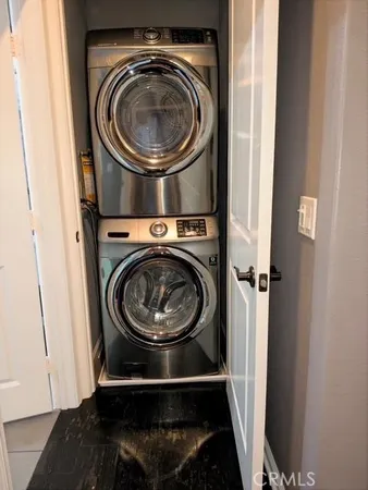 a view of a kitchen with wooden floor and a sink