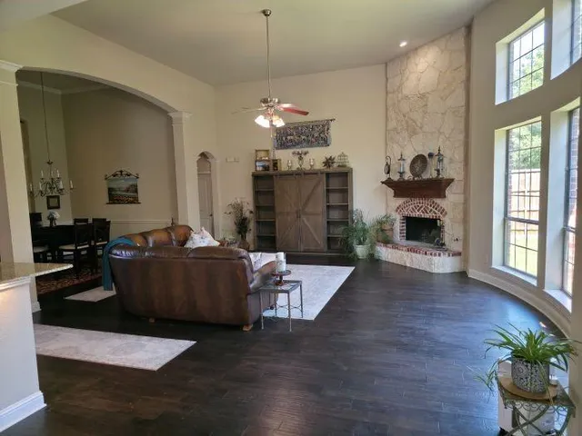 a living room with furniture and a fireplace