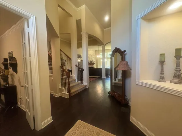 a view of a hallway with seating area