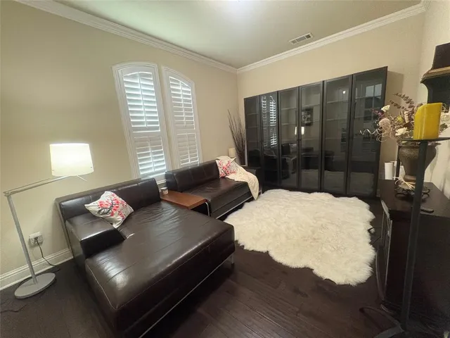 a bedroom with bed and window