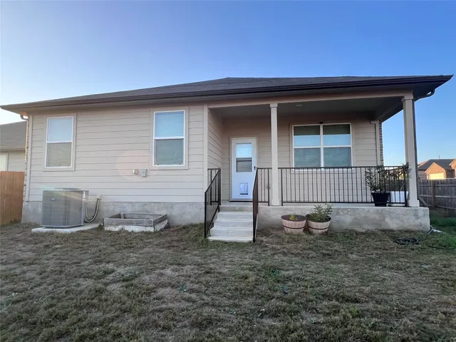 a backyard of a house with oven