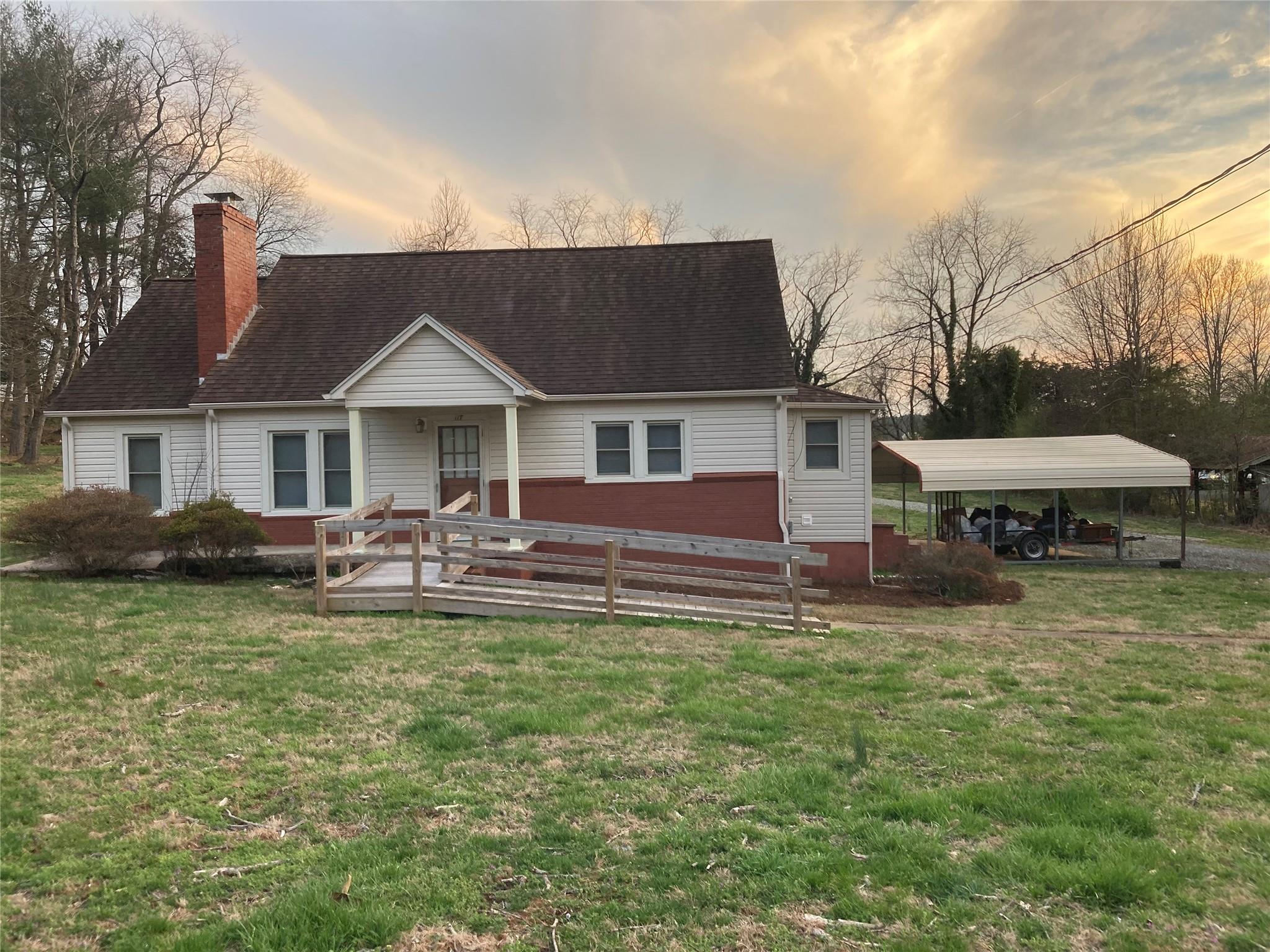 117 Water Filter Plant Road Morganton, NC 28655 - Photo 1 of 30 a front view of a house with a yard table and chairs