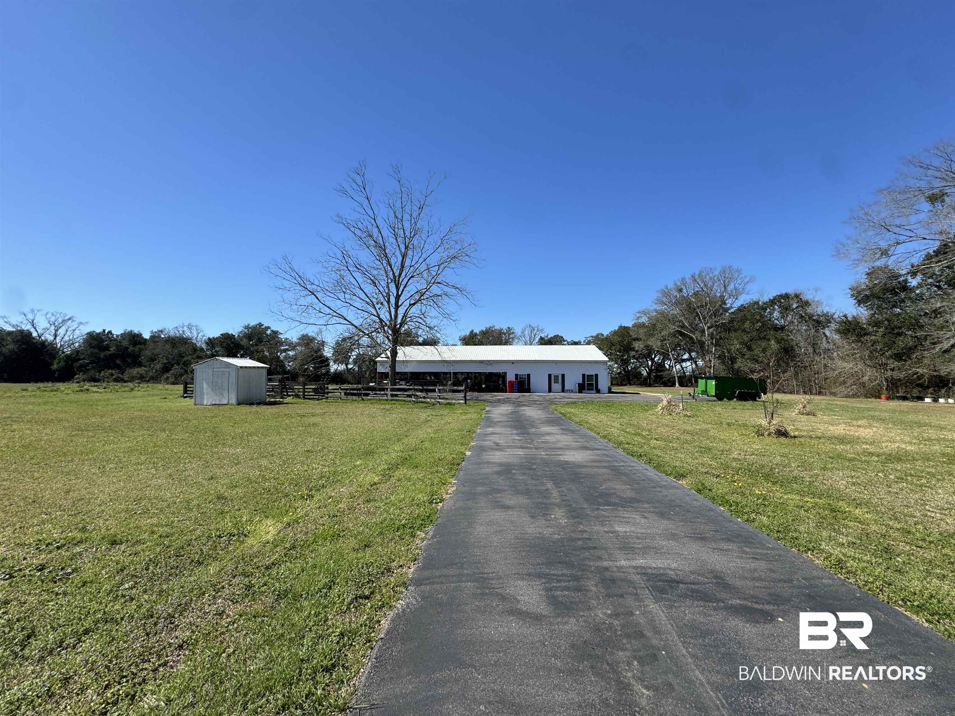 15165 Daugherty Road Foley, AL 36535 - Photo 51 of 70 View of front of home with a storage unit and a front yard