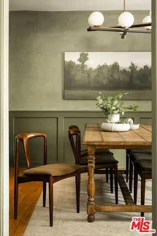 a view of a dining room with furniture and window