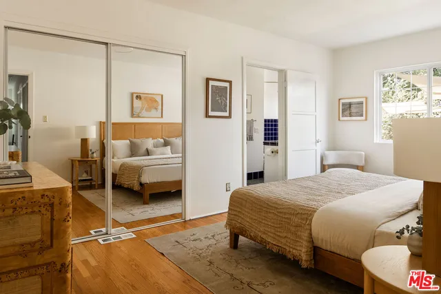 a bedroom with a bed and a couch